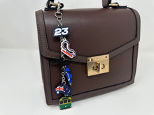 Load image into Gallery viewer, Navy Racing Down Under (Carlos, Alex) Bag Charm - EnchantedByGi