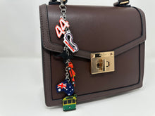 Load image into Gallery viewer, Tifosi Down Under (Charles, Lewis) Bag Charm - EnchantedByGi
